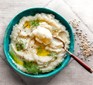 Bowl of cauliflower purée topped with dill