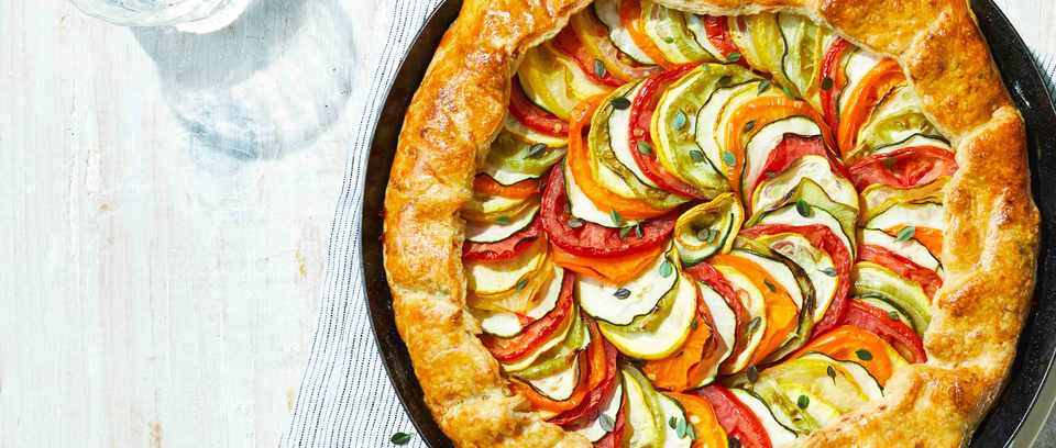 Ratatouille tart with spirals of courgette and tomato