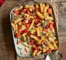 Chicken, spinach and bacon alfredo pasta bake in a baking dish
