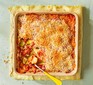 Baked courgette & tomato gratin in a casserole dish