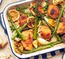 Lemon roasted spring chicken with asparagus in a roasting tin