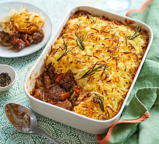 Rosti topped lamb and rosemary pie in a baking dish