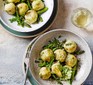 Pea gnudi with asparagus & mint served in two bowls