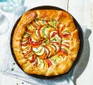 Ratatouille tart with flaky cheddar & thyme pastry on a white table