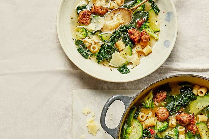 Sausage & kale minestrone in a large pot and bowl