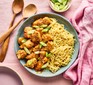 Sesame lemon chicken in bowl with noodles