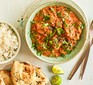 Slow cooker chicken tikka masala served with rice and naan bread