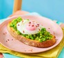 Smashed peas on toast with an egg on top