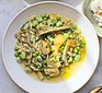 Spring vegetable orzo with broad beans, peas, artichokes & ricotta served in a bowl