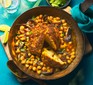 A pan with whole-roasted curried cauliflower & chickpeas