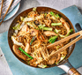 Chicken chow mein in a wok